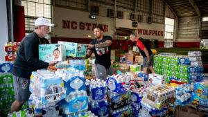 Volunteers collect water donations as part of NC State's Hurricane Helene relief efforts.